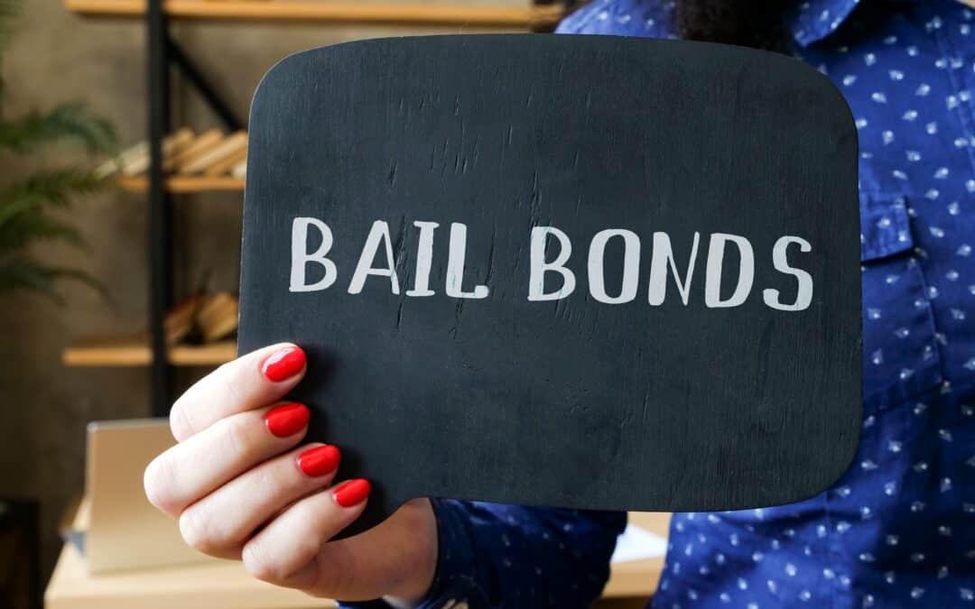 Bail bonds sign held by bondsman for Gulfport jail release